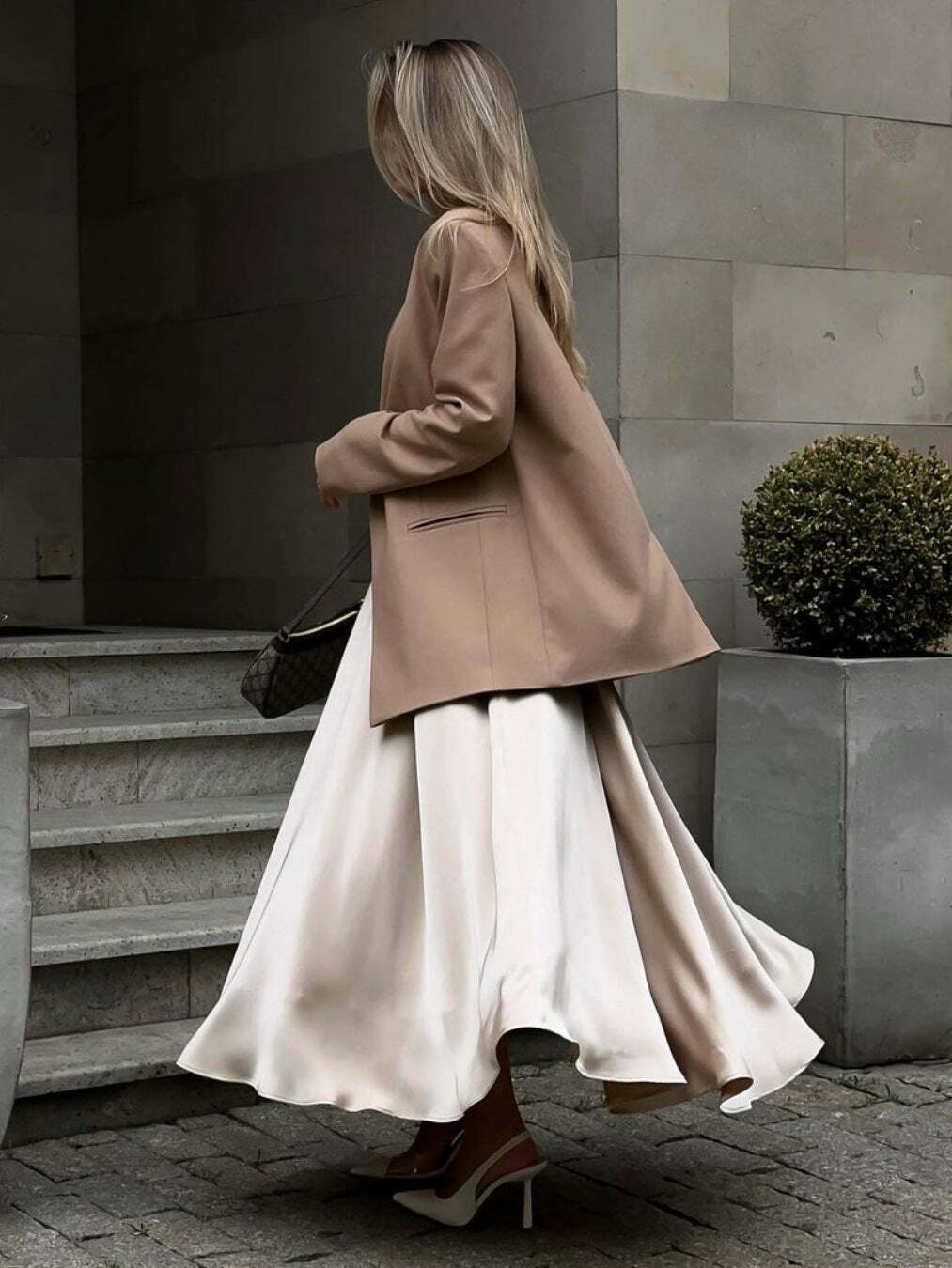 Vintage-inspired high-waisted satin maxi skirt for a timeless and chic look